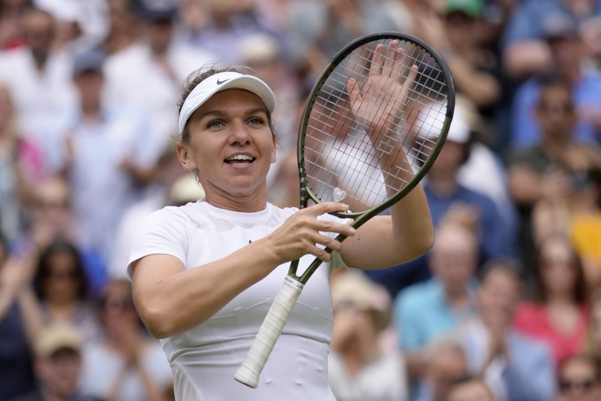 Romania&#039;s Simona Halep reacts after beating Amanda Anisimova of the US in a women&#039;s singles quarterfinal match on day ten of the Wimbledon tennis championships in London, Wednesday, July 6,  ...