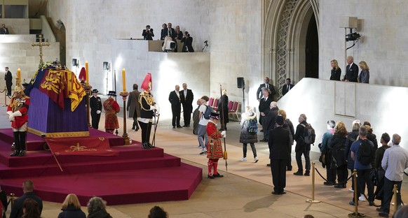 US President Joe Biden and First Lady Jill Biden, far right, view the coffin of Queen Elizabeth II lying in state on the catafalque in Westminster Hall, at the Palace of Westminster, London, Sunday Se ...