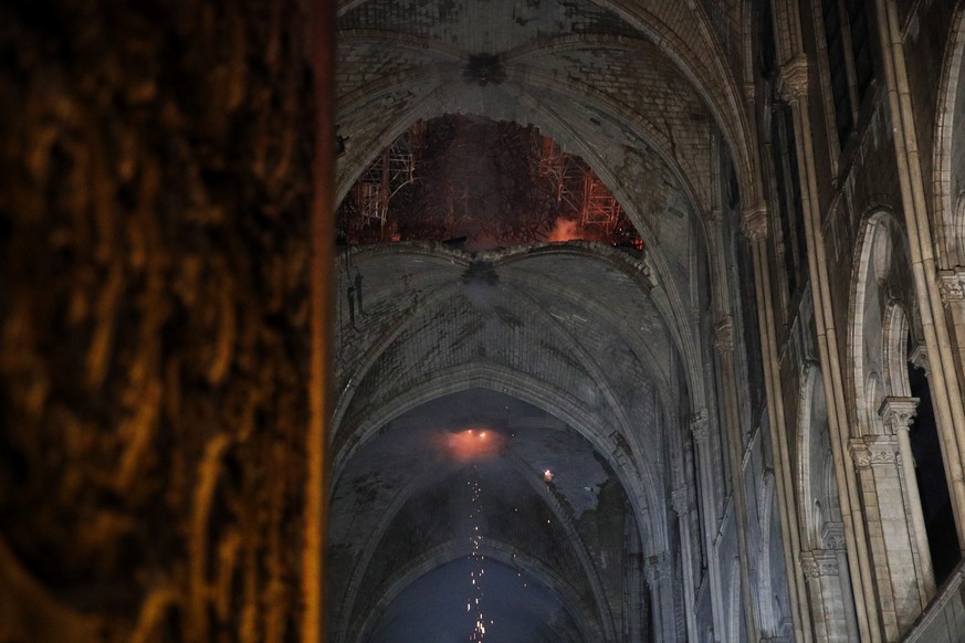 epa07509131 General view of the roof of the Notre-Dame Cathedral after a massive fire in Paris, France, late 15 April 2019. A fire started in the late afternoon in one of the most visited monuments of ...