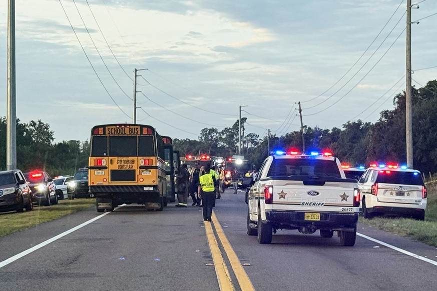 In this photo provided by the Polk County Sheriff's Office, emergency personnel respond to an accident involving a school bus in Winter Haven, Fla., on Monday, Oct. 5, 2026. (Polk County Sheriff& ...