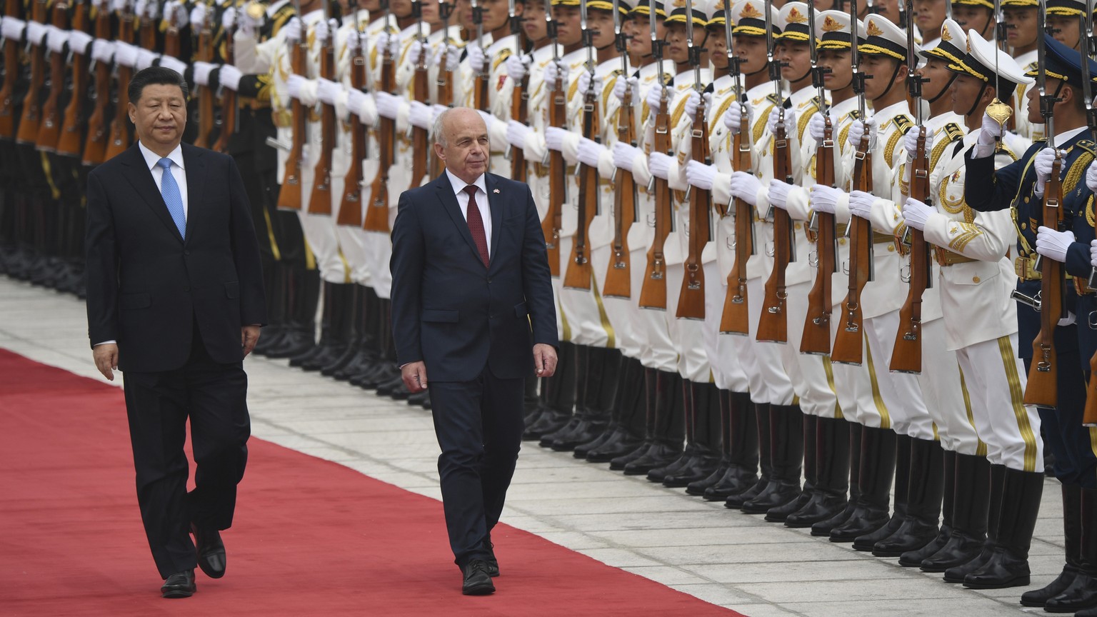Switzerland&#039;s President Ueli Maurer, right, and China&#039;s President Xi Jinping review an honor guard during a welcome ceremony at the Great Hall of the People, Monday, April 29, 2019, in Bejin ...