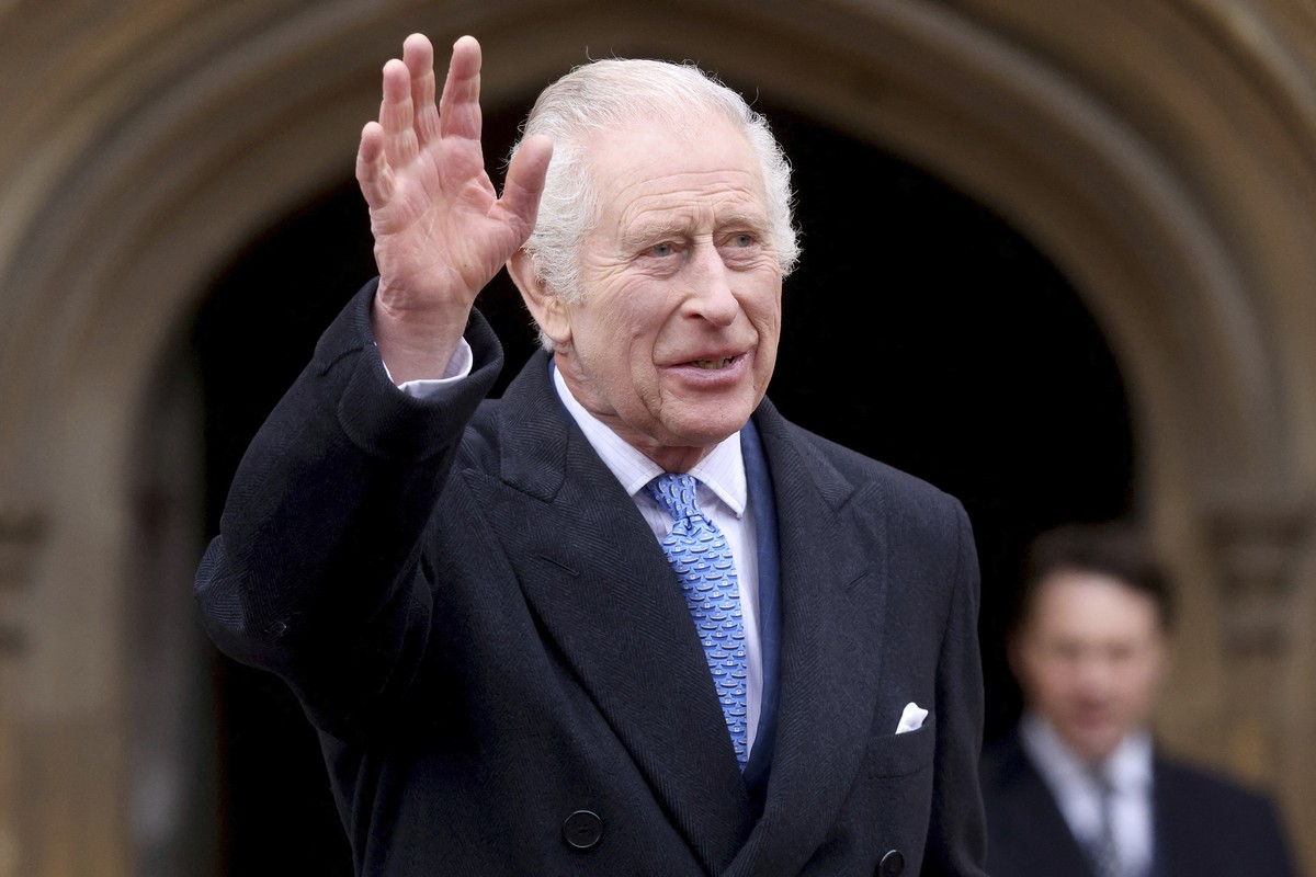 Britain's King Charles III waves as he leaves after attending the Easter Matins Service at St. George's Chapel, Windsor Castle, England, Sunday, March 31, 2024. (Hollie Adams/Pool Photo via  ...