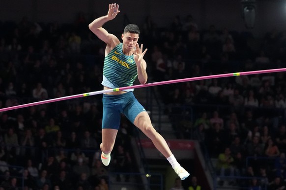 FILE - Thiago Braz, of Brazil, makes an attempt in in the Men&#039;s pole vault at the World Athletics Indoor Championships in Belgrade, Serbia, on March 20, 2022. Olympic pole vault gold medalist Thi ...
