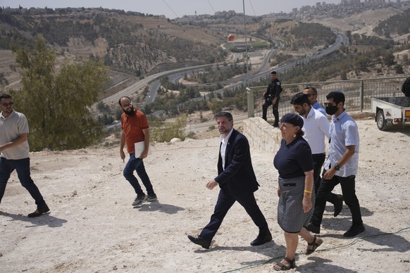 CORRECTS DAY Israeli Finance Minister Bezalel Smotrich arrives for a press conference about new settlement construction in the Israel-occupied West Bank near Maale Adumim, Thursday, Aug. 14, 2025. (AP ...