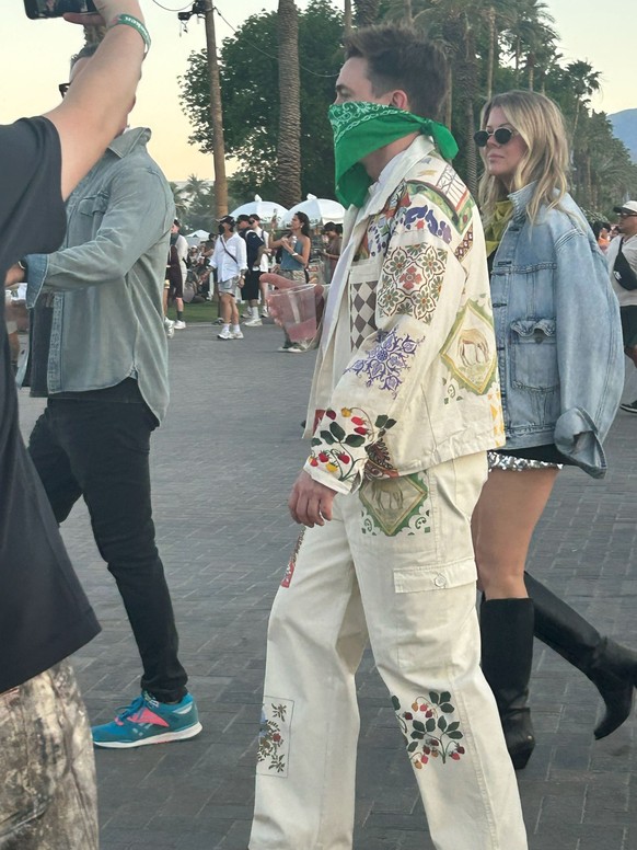 Singer Jesse McCartney dons a bandana while walking to the Outdoor Theatre VIP area at Coachella 2026 on Saturday, April 11, 2026 in Indio, Calif.