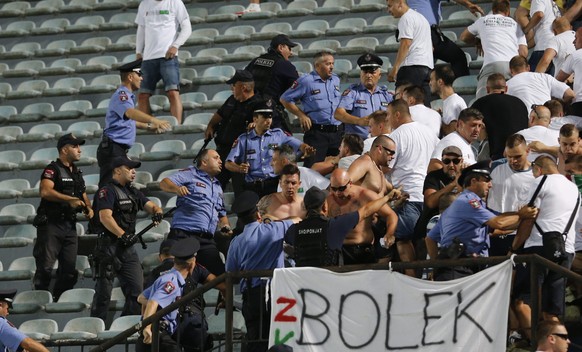 epa04866871 Albanian police clash with supporters of Legia Warsaw during the UEFA Europa League third qualifying round first leg soccer match between FK Kukesi and Legia Warsaw, in Tirana, Albania, 30 ...