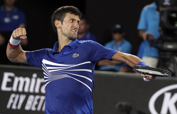 Serbia&#039;s Novak Djokovic celebrates after winning a point against United States&#039; Mitchell Krueger during their first round match at the Australian Open tennis championships in Melbourne, Aust ...