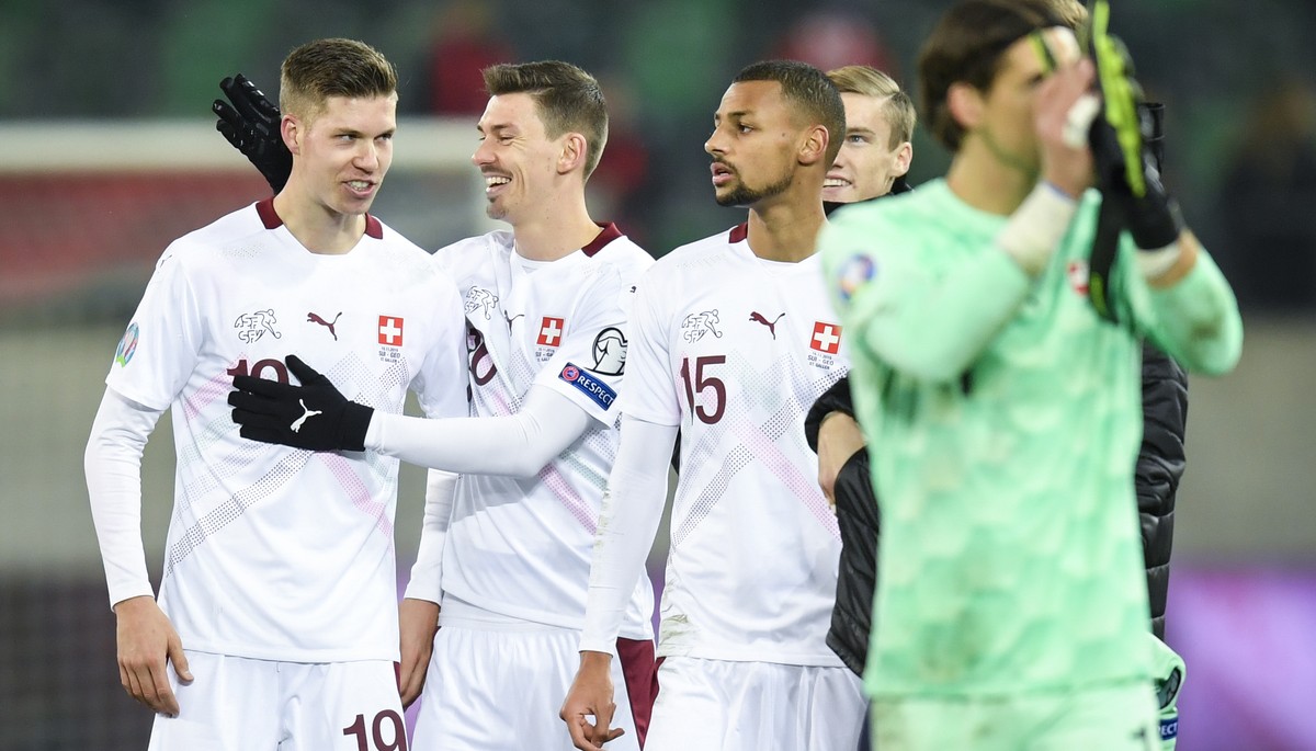 Switzerland's Cedric Itten, left, and Christian Fassnacht celebrate after the UEFA Euro 2020 qualifying Group D soccer match between Switzerland and Georgia at the Kybunpark stadium in St. Gallen ...