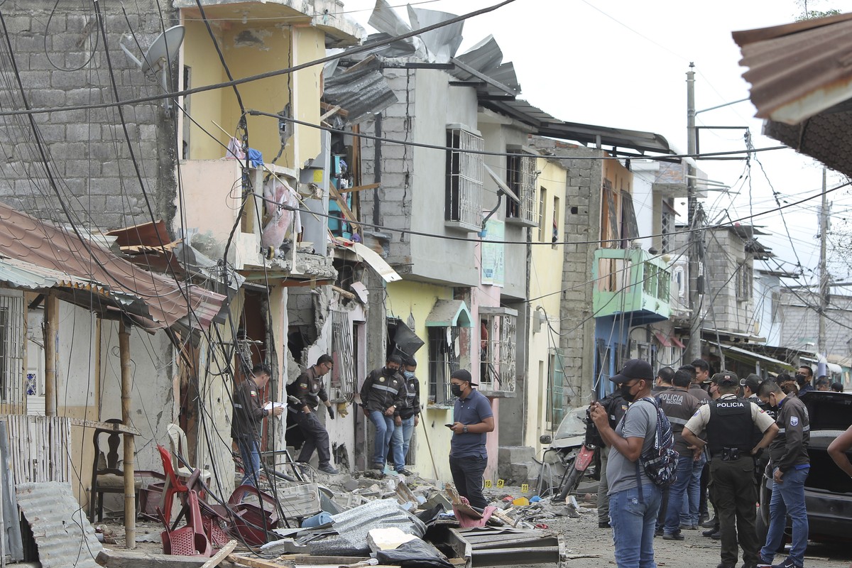Police investigate the site of an explosion in the Cristo de El Consuelo neighborhood, in Guayaquil, Ecuador, Sunday, Aug. 14, 2022. According to the authorities a gunshot attack and subsequent explos ...