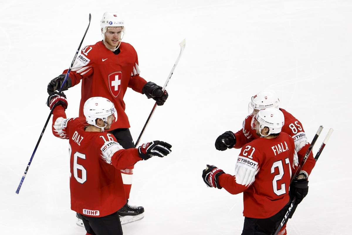Switzerland's defender Raphael Diaz, left, celebrates his goal with teammates defender Mirco Mueller #41, forward Kevin Fiala #21 and forward Sven Andrighetto #85, after scoring the 2:3, during t ...