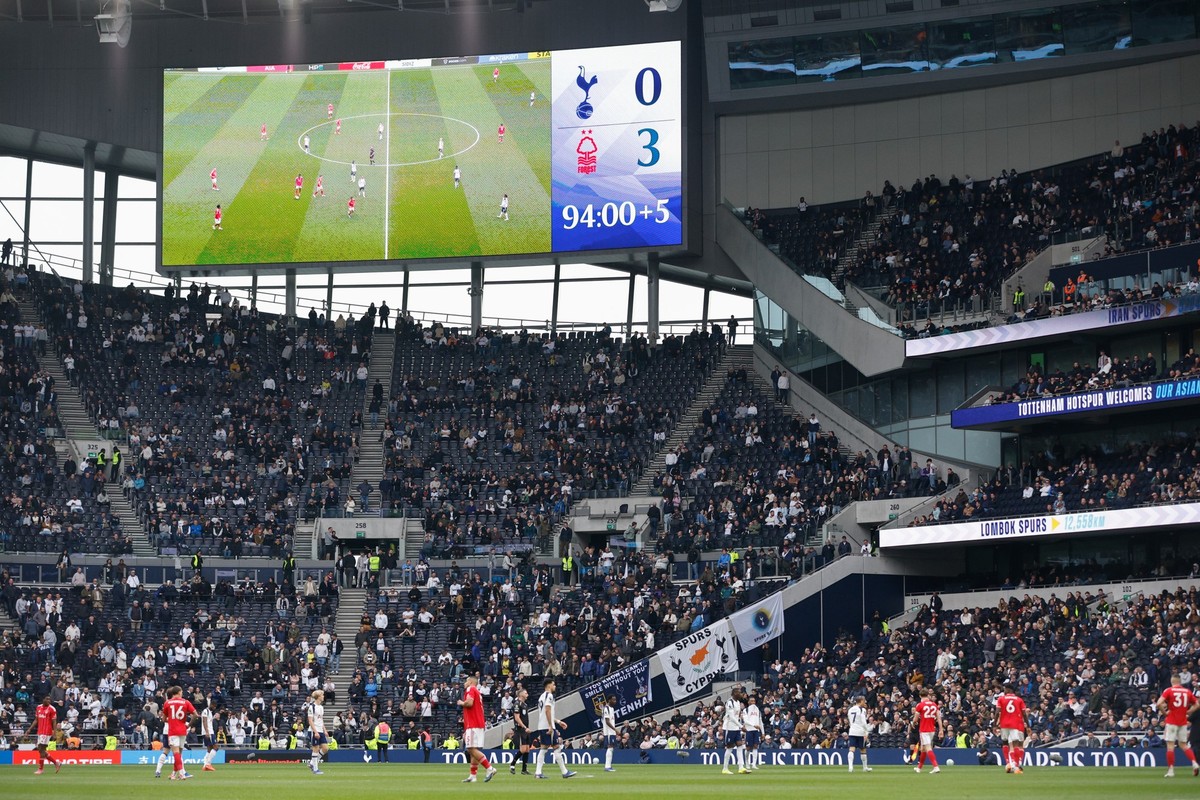 epa12841771 Swathes of empty seats after fans leave early with the score at 0-3 during the English Premier League match of Tottenham Hotspur against Nottingham Forest, in London, Britain, 22 March 202 ...