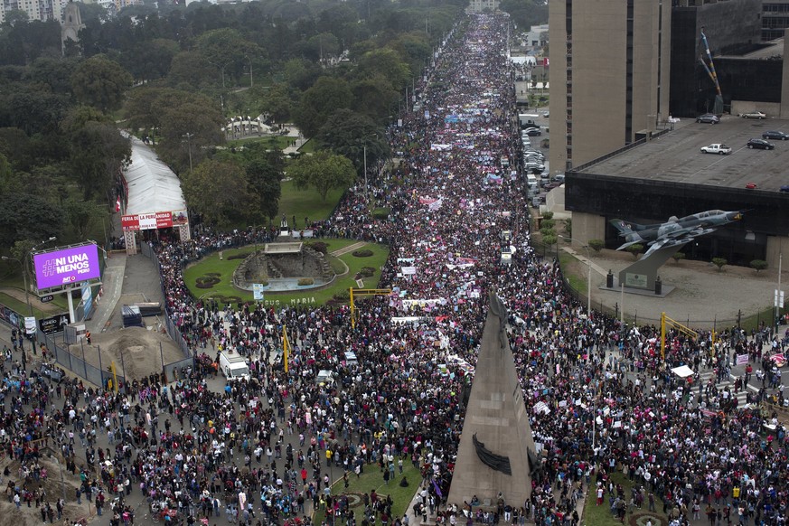 Thousands of people march against domestic violence in Lima, Peru, Saturday, Aug. 13, 2016. Almost a hundred women are killed every year in domestic violence cases according to local authorities. (AP  ...