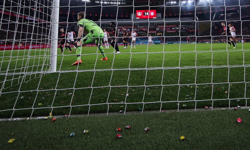epa11143065 Candies on the pitch during the German Bundesliga soccer match between Bayer 04 Leverkusen and FC Bayern Munich in Leverkusen, Germany, 10 February 2024. EPA/CHRISTOPHER NEUNDORF CONDITION ...