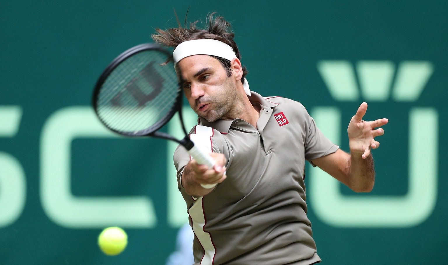 epa07656242 Roger Federer from Switzerland in action during his first round match against John Millman from Australia at the ATP Tennis Tournament Gerry Weber Open in Halle Westphalia, Germany, 18 Jun ...