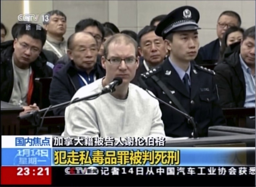 In this image taken from a video footage run by China&#039;s CCTV, Canadian Robert Lloyd Schellenberg attends his retrial at the Dalian Intermediate People&#039;s Court in Dalian, northeastern China&# ...