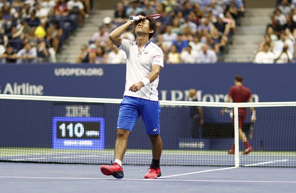 epa06979873 Yoshihito Nishioka of Japan (L) reacts as he plays Roger Federer of Switzerland on the second day of the US Open Tennis Championships the USTA National Tennis Center in Flushing Meadows, N ...