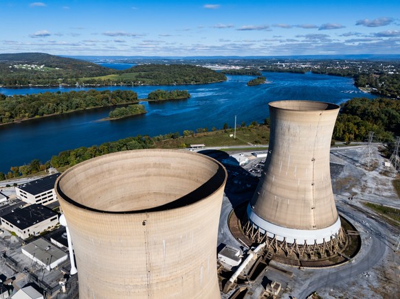 epa11653251 An image made with a drone shows the cooling towers of the shuttered Three Mile Island nuclear power plant near Middletown, Pennsylvania, USA, 10 October 2024. According to Constellation E ...