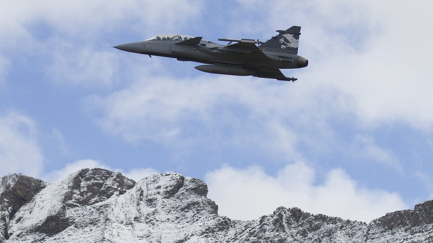 FILE --- A Saab Jas Gripen F Demonstrator jet performs during a flight show of the Swiss air force in Axalp near Meiringen, Switzerland, Thursday, October 11, 2012. Swiss voters vote on the purchase o ...