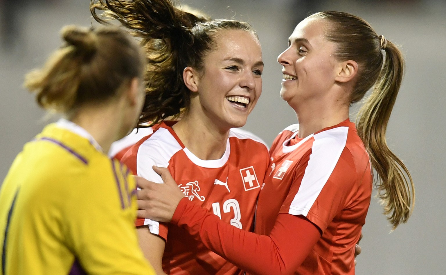 Swiss Lia Waelti, left, and Vanessa Bernauer, right, celebrates after the seconf goal for Switzerland during the women&#039;s World Championship qualifying soccer match between Switzerland and Belarus ...