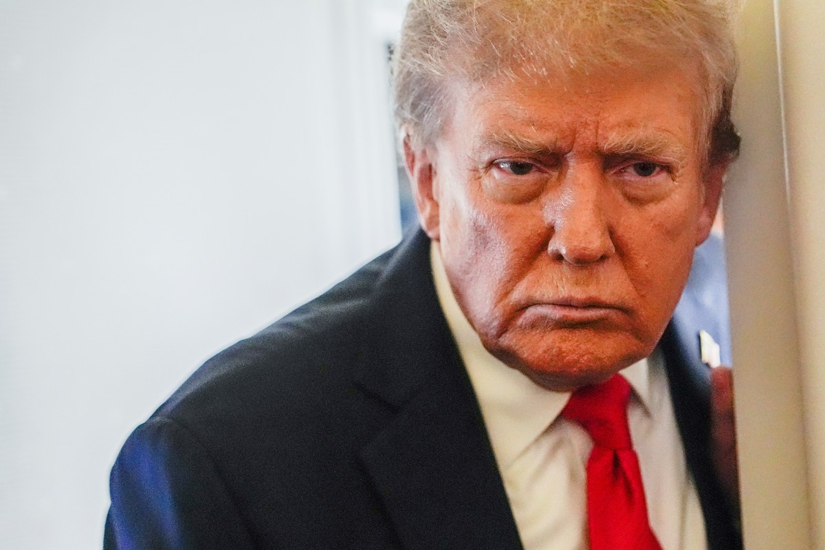 President Donald Trump speaks to reporters aboard Air Force One while en route to meet with Russia's President Vladimir Putin at Joint Base Elmendorf-Richardson, Alaska, Friday, Aug. 15, 2025. (A ...