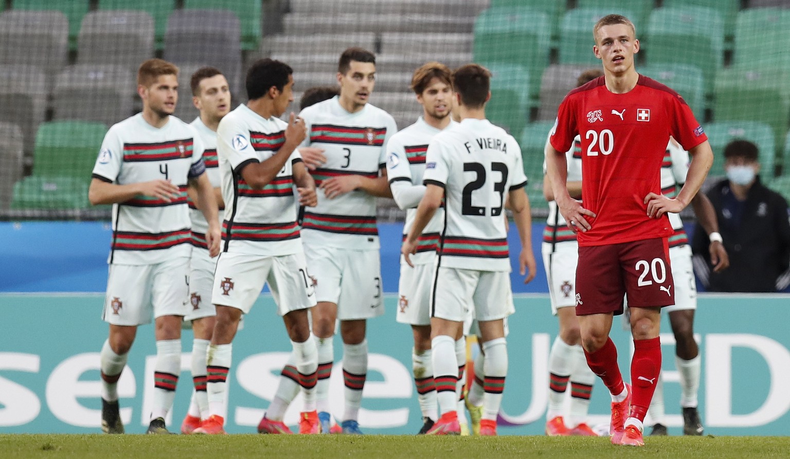 epa09108863 Switzerland&#039;s Miro Muheim (R) reacts as Portuguese players celebrate their 2-0 lead during the UEFA European Under-21 Championship group D soccer match between Switzerland and Portuga ...