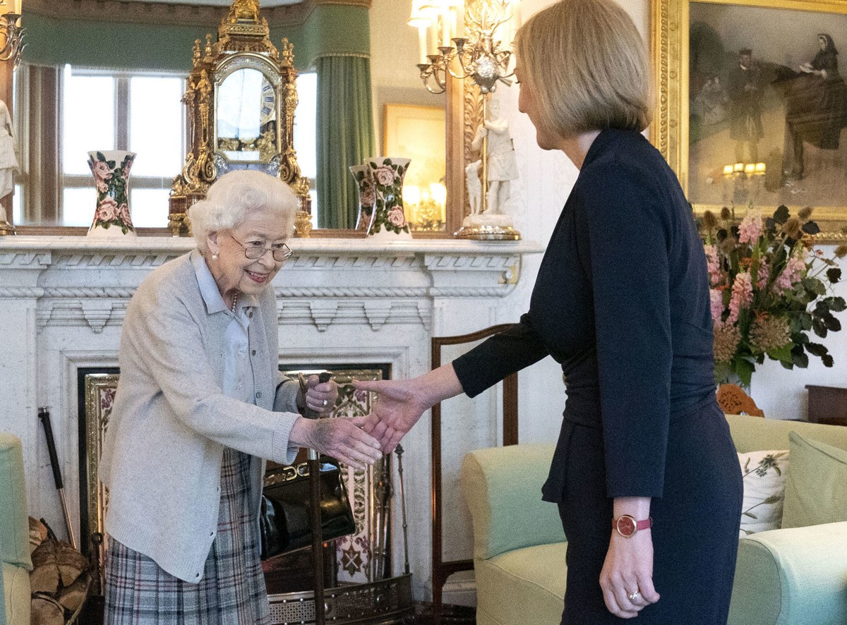 Britain's Queen Elizabeth II, left, welcomes Liz Truss during an audience at Balmoral, Scotland, where she invited the newly elected leader of the Conservative party to become Prime Minister and  ...