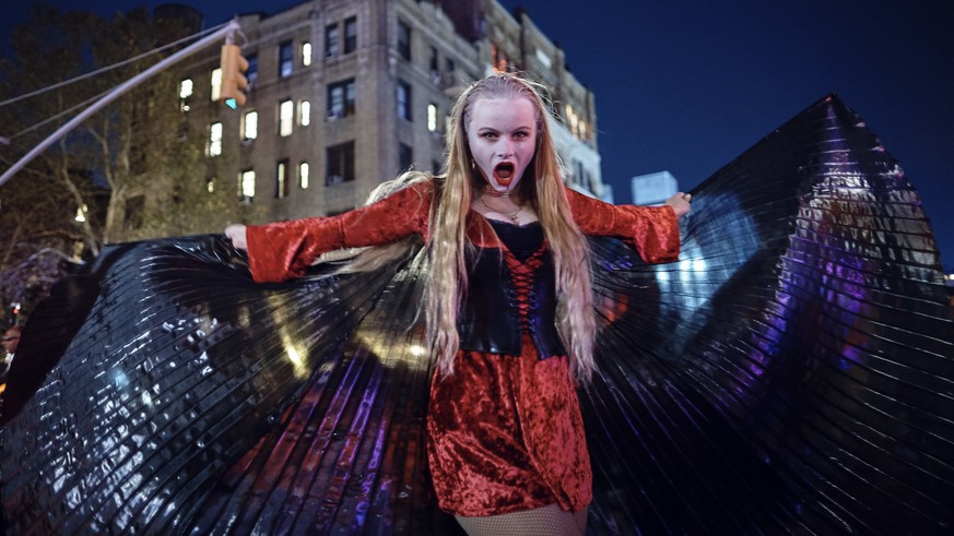 A reveler performs during the Greenwich Village Halloween Parade, Tuesday, Oct. 31, 2017, in New York. (AP Photo/Andres Kudacki)