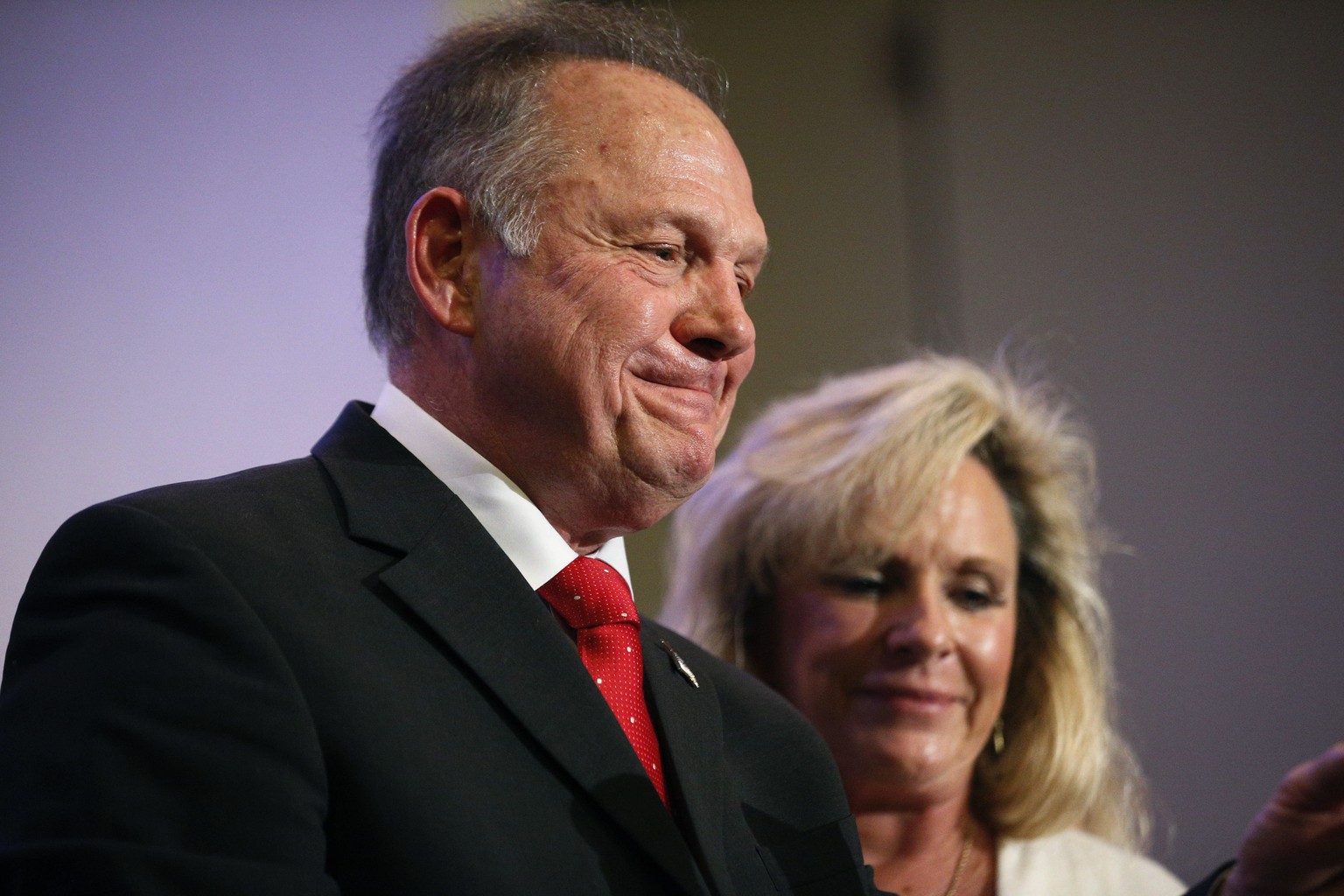 In this Nov. 16, 2017, photo, former Alabama Chief Justice and U.S. Senate candidate Roy Moore speaks at a news conference in Birmingham, Ala., with his wife Kayla Moore, right. A sex scandal has rele ...