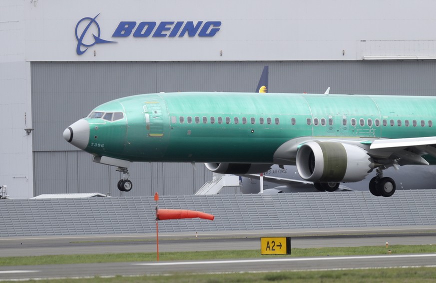 FILE - In this April 10, 2019, file photo a Boeing 737 MAX 8 airplane being built for India-based Jet Airways lands following a test flight at Boeing Field in Seattle. Boeing Co. reports earnings Wedn ...