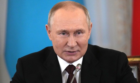 epa10229378 Russian President Vladimir Putin attends an informal annual summit of the Commonwealth of Independent States (CIS) heads of state at the Konstantin Palace presidential residence in Strelna ...
