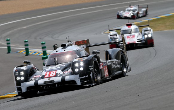 LE MANS,FRANCE,13.JUN.15 - MOTORSPORTS - WEC, World Endurance Championship, 24 hours of Le Mans. Image shows Romain Dumas (FRA), Neel Jani (SUI) and Marc Lieb (GER/ Porsche Team), Marcel Faessler, And ...