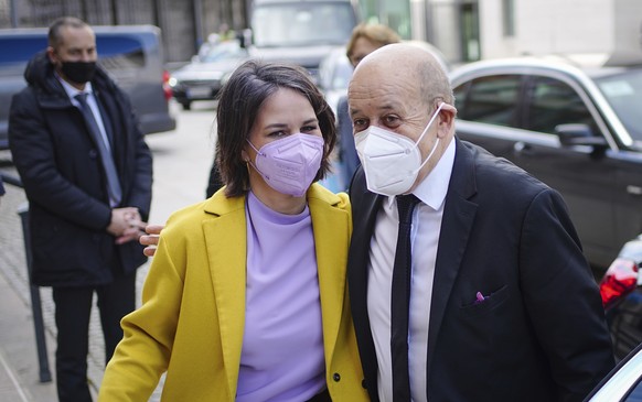 German Foreign Minister Annalena Baerbock, left, welcomes French Foreign Minister Jean-Yves Le Drian for a joint meeting at the Federal Foreign Office in Berlin, Germany, Wednesday, Feb. 23, 2022. (Ka ...