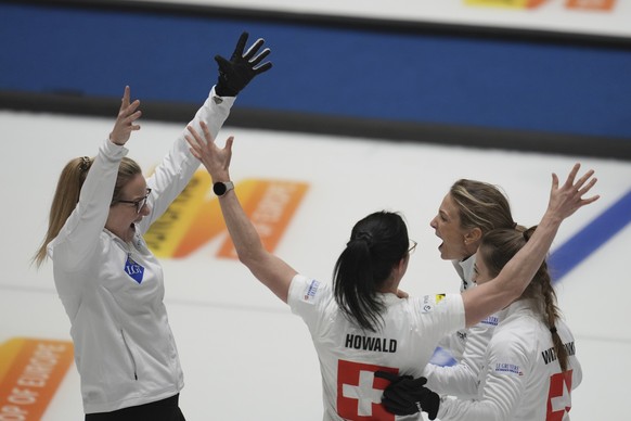 Switzerland's skip Silvana Tirinzoni, second from right, celebrates with teammates after winning the semifinal match against China at the World Women's Curling Championship in Uijeongbu, Sou ...