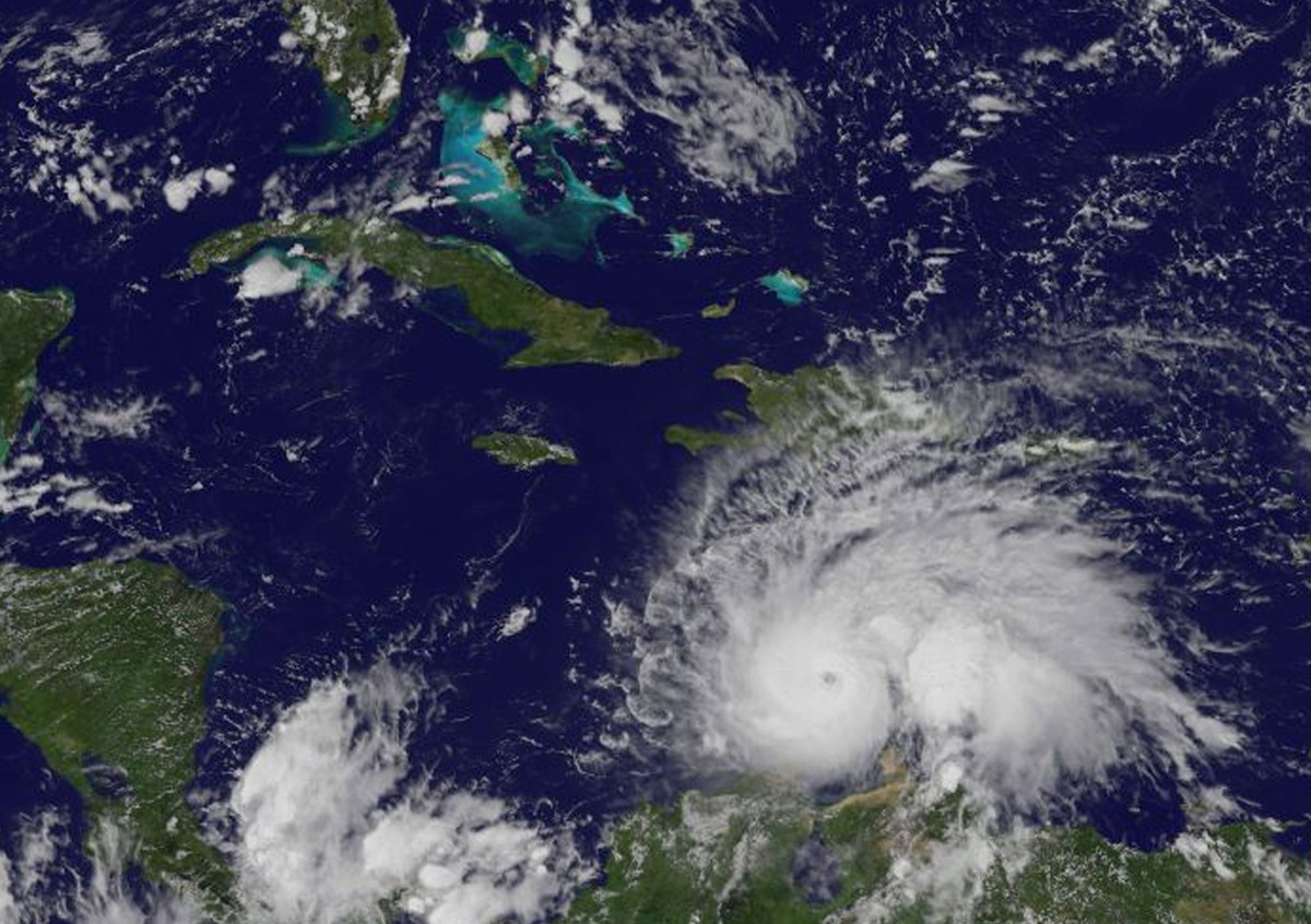 epa05564709 A handout visible-light image made available by NASA's NOAA GOES Project and taken from space by the NOAA GOES-East satellite on 30 September 2016 at 1:45 pm EDT shows Hurricane Matth ...