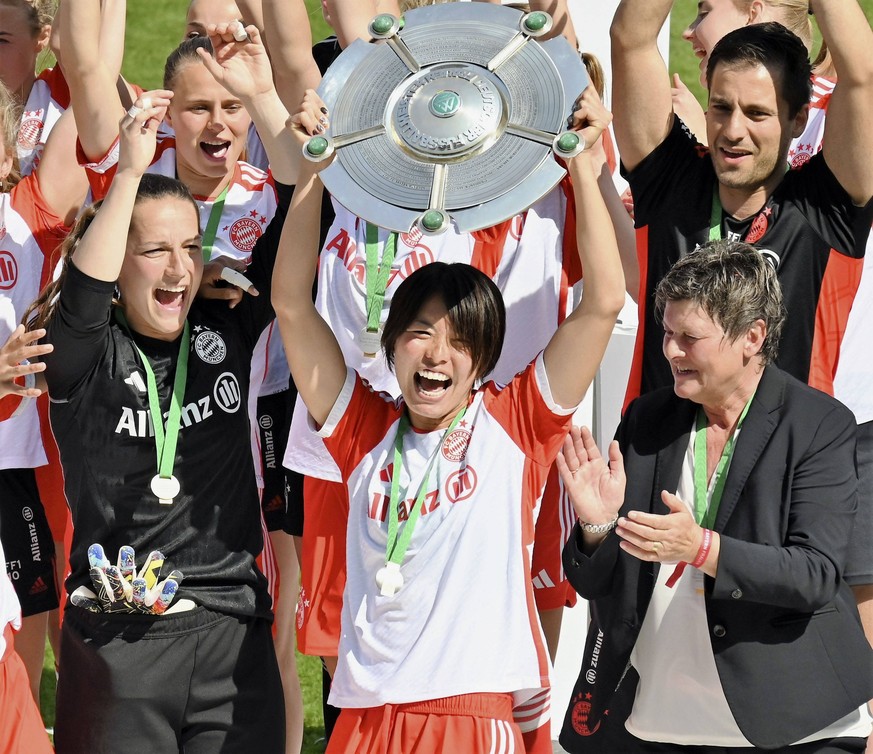 Football: Bayern women win league title Bayern Munich s Saki Kumagai lifts silverware and celebrates winning the women s Bundesliga title in Germany s top flight football league in Munich on May 28, 2 ...