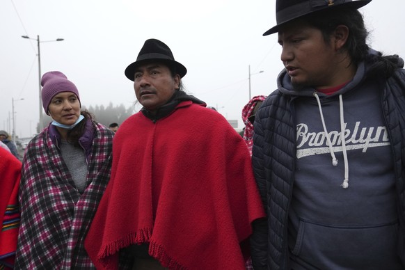 Indigenous Leader Leonidas Iza,center, talks with protesters at a blockade point during a national protest against the government of Guillermo Lasso called mainly by indigenous organizations in Cotopa ...