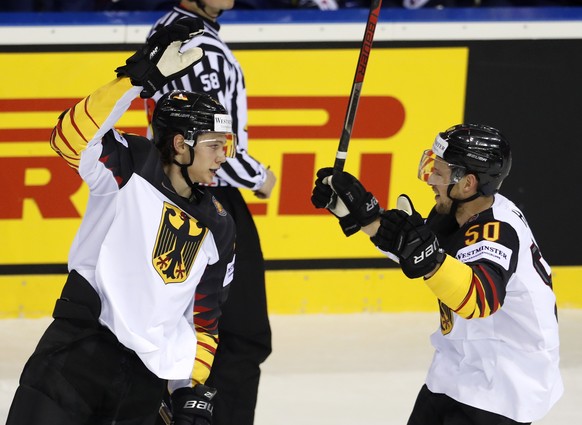 Germany&#039;s Moritz Seider, left, celebrates with Germany&#039;s Patrick Hager, right, after scoring his sides first goal during the Ice Hockey World Championships group A match between Germany and  ...