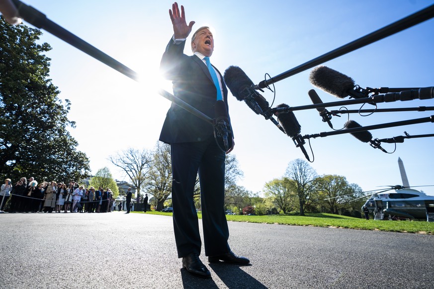 epa07496455 US President Donald J. Trump speaks to the media before departing for fundraisers in Texas outside the White House in Washington, DC, USA, 10 April 2019. The President spoke repeatedly abo ...