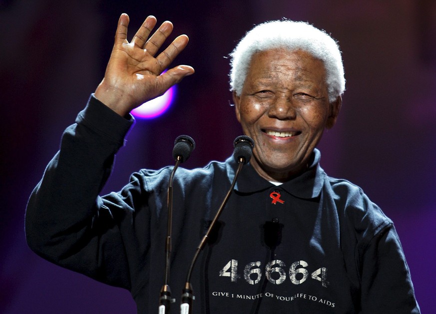 epa06894439 (FILE) - Nelson Mandela waving to the crowd at the Africa Standing Tall Against Poverty concert linked to Live 8 in Johannesburg, South Africa, 02 July 2005 (reissued 17 July 2018). Nelson ...