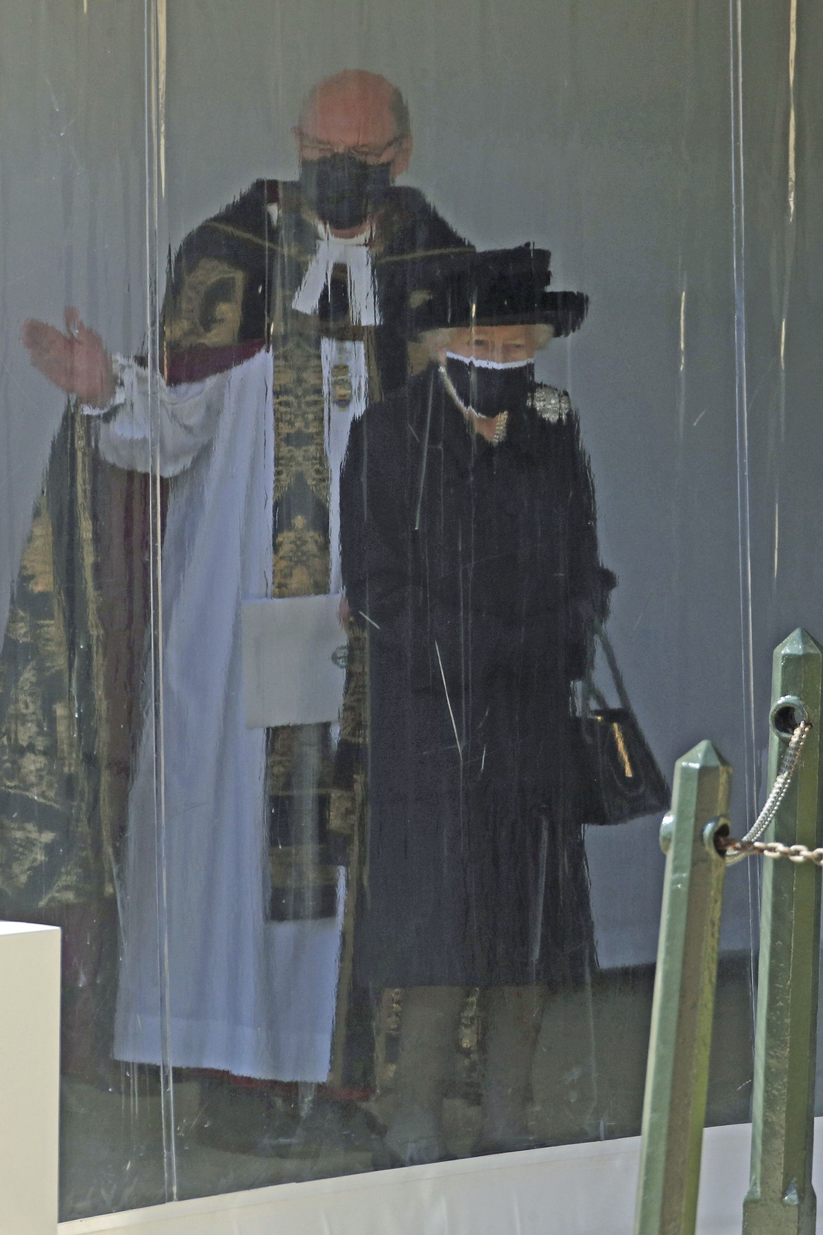 Queen Elizabeth II with The Dean of Windsor watch the procession at the Galilee Porch of St George's Chapel, Windsor Castle, Windsor, England, Saturday April 17, 2021, during the funeral of Brita ...
