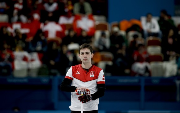 Switzerland&#039;s skip Peter de Cruz holds his broom during a men&#039;s semi-final curling match against Sweden at the 2018 Winter Olympics in Gangneung, South Korea, Thursday, Feb. 22, 2018. (AP Ph ...