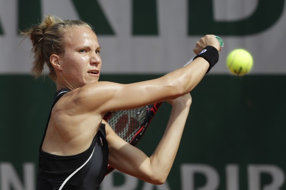 Switzerland&#039;s Viktorija Golubic returns a shot against Caroline Dolehide of the U.S. during their first round match of the French Open tennis tournament at the Roland Garros stadium in Paris, Fra ...