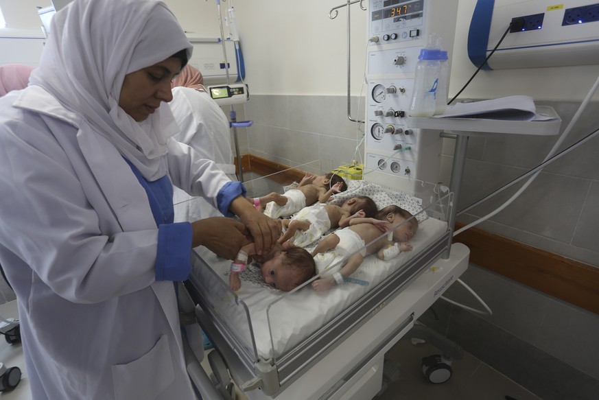 Medical staff care for prematurely born Palestinian babies that were brought from Shifa Hospital in Gaza City to the hospital in Rafah, Gaza Strip, Sunday, Nov. 19, 2023. (AP Photo/Hatem Ali)