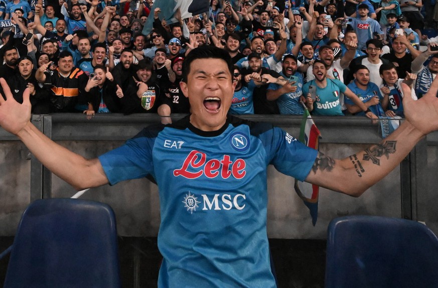 epa10614460 Napoli&#039;s Kim Min-Jae celebrates with fans and teammates in celebration of their side&#039;s third-ever league title victory, the Scudetto, after winning the Serie A soccer match betwe ...