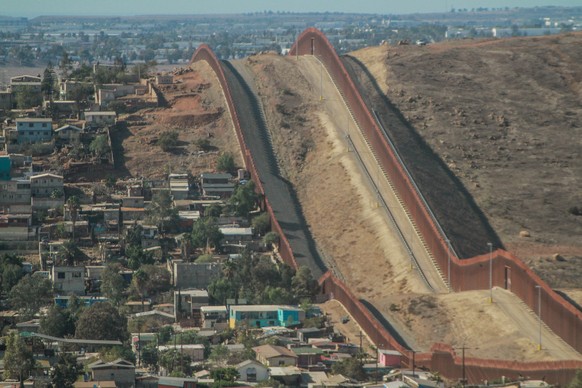 epa08956855 View of the US border wall in the city of Tijuana, Baja California, Mexico, 21 January 2021. The halt on the construction of the wall on the border between the United States and Mexico, an ...