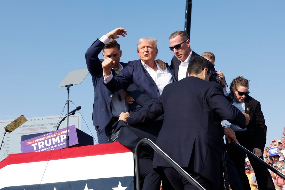 BUTLER, PENNSYLVANIA - JULY 13: Republican presidential candidate former President Donald Trump is rushed offstage during a rally on July 13, 2024 in Butler, Pennsylvania. Butler County district attor ...