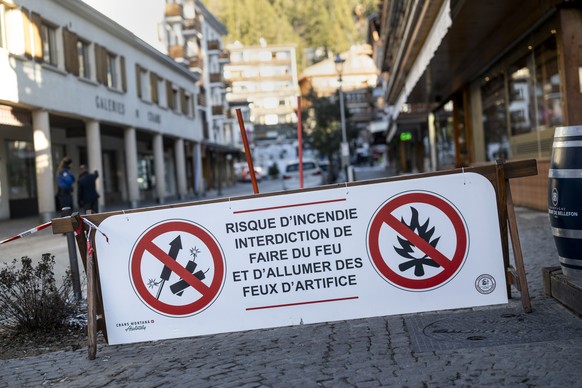 KEYPIX - A banner stating that fireworks are prohibited due to the risk of fire is pictured near the area where a fire broke out at the Le Constellation bar and lounge following an explosion in the ea ...