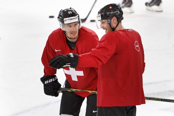 Switzerland&#039;s Mark Streit, right, speaks to his teammate Roman Josi, during a training session of the IIHF 2015 World Championship at the Tipsport Arena, in Prague, Czech Republic, Friday, Mai 1, ...