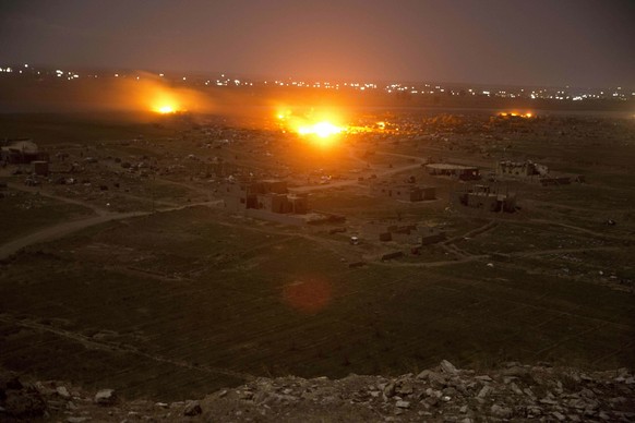 In this Monday, March 18, 2019, photo, Islamic State militant positions are ablaze in Baghouz, Syria as U.S-backed Syrian Democratic forces pound the group&#039;s remaining territory. On Tuesday, a sp ...