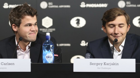Chess world champion Magnus Carlsen, of Norway, left, and his challenger, Sergey Karjakin, of Russia, participate in a news conference for promote the World Chess Championship in New York, Thursday, N ...